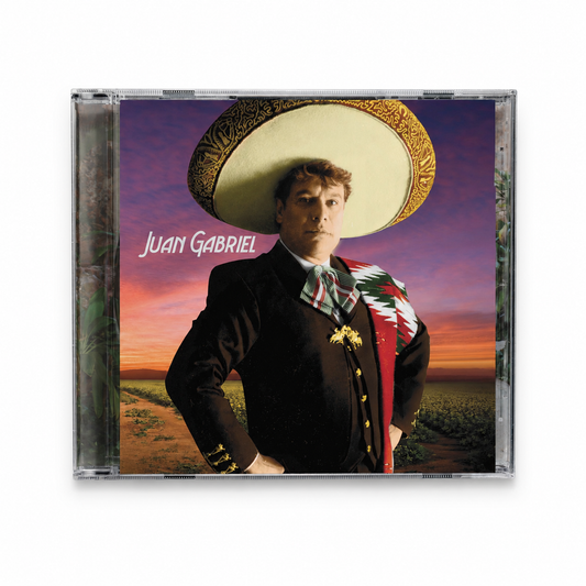 CD cover of Juan Gabriel with a person wearing a sombrero against a sunset background